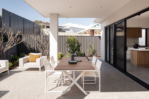 Alfresco dining area under the roofline, opening back into the kitchen